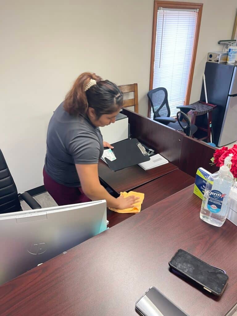 commercial cleaning service on office desk