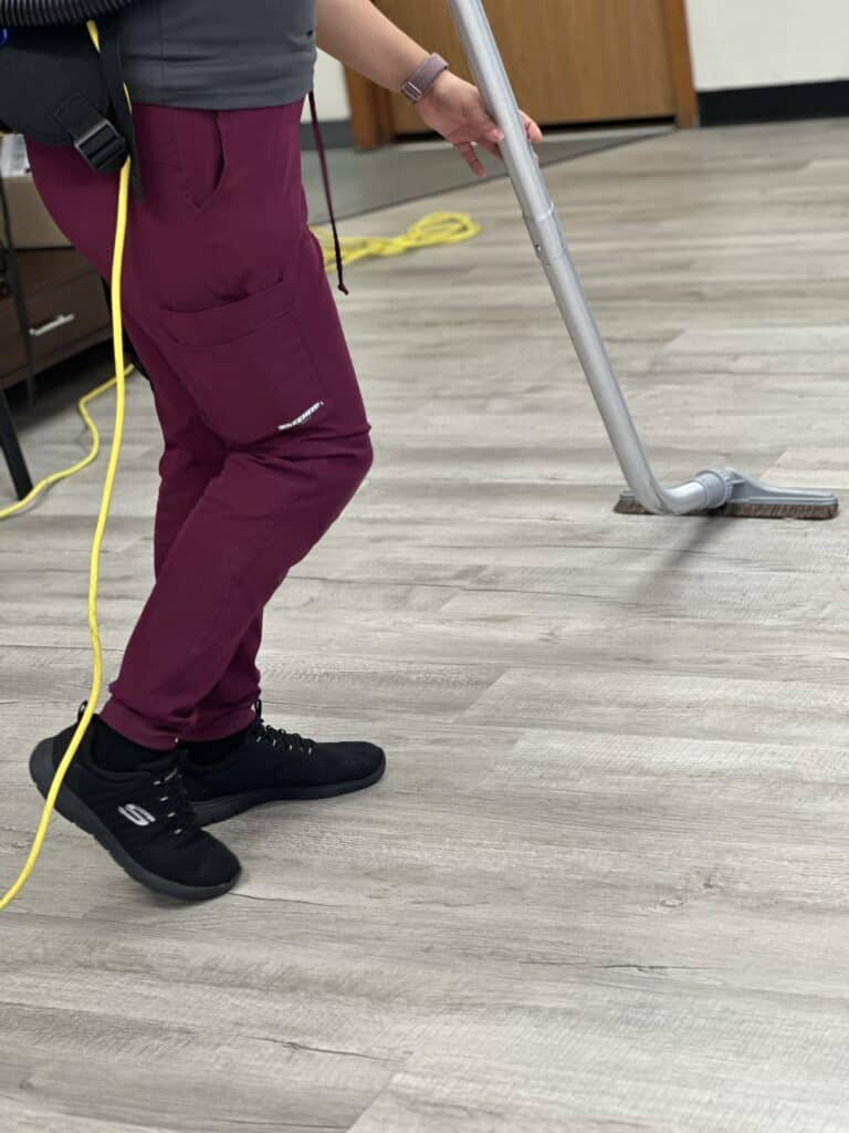 tessa cleaning worker cleaning office floor
